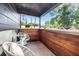 Relaxing balcony with outdoor seating and a view of lush greenery, offering a peaceful retreat at 3228 7Th N Ave, St Petersburg, FL 33713