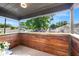 Cozy balcony with wood paneling, scenic views of the neighborhood, and an outdoor ceiling light at 3228 7Th N Ave, St Petersburg, FL 33713