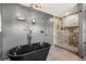 Sleek bathroom featuring a freestanding tub, glass-enclosed shower, and modern fixtures at 3228 7Th N Ave, St Petersburg, FL 33713