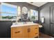 Bathroom featuring a wood vanity, a white countertop, and modern lighting fixtures at 3228 7Th N Ave, St Petersburg, FL 33713