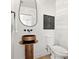 Modern bathroom features a custom sink, unique mirror and stylish artwork at 3228 7Th N Ave, St Petersburg, FL 33713