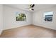 Spacious bedroom featuring modern ceiling fan, ample natural light and hardwood floors at 3228 7Th N Ave, St Petersburg, FL 33713