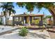 Charming home features a gray exterior, yellow shutters, and a landscaped yard at 3228 7Th N Ave, St Petersburg, FL 33713