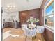 Eat-in kitchen features modern lighting, stainless appliances, and a glass table with seating at 3228 7Th N Ave, St Petersburg, FL 33713