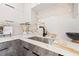 Close-up of the updated kitchen with stainless steel appliances and a black faucet at 3228 7Th N Ave, St Petersburg, FL 33713