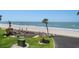 Beach access with dining area and seating at 3500 Gulf Blvd # 314, Belleair Beach, FL 33786
