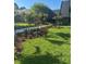 Manicured landscaping enhances the curb appeal of this building with mature trees and vibrant green grass at 36750 Us 19 N # 5-111, Palm Harbor, FL 34684