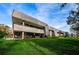 Modern architecture features balconies, patio, and well-maintained green lawns at 36750 Us 19 N # 5-111, Palm Harbor, FL 34684