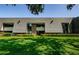 Well-maintained building with manicured lawn and landscaping at 36750 Us 19 N # 5-111, Palm Harbor, FL 34684