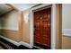 Condo front door on a hallway with unit number and decorative trim at 36750 Us 19 N # 5-111, Palm Harbor, FL 34684