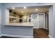 Kitchen with stainless steel appliances, granite countertops, decorative backsplash, and bar height counter at 36750 Us 19 N # 5-111, Palm Harbor, FL 34684