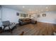 Spacious living room with wood floors, comfy seating, and neutral paint at 36750 Us 19 N # 5-111, Palm Harbor, FL 34684