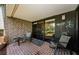 Relaxing patio area with brick flooring, table, and chairs with outdoor view at 36750 Us 19 N # 5-111, Palm Harbor, FL 34684