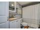 Well-lit bathroom with a tiled backsplash, vanity with storage, and shower-tub combination at 3721 140Th Ave, Largo, FL 33771