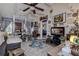 Cozy living room with wood-look floors, vaulted ceilings, and decoratively adorned walls at 3721 140Th Ave, Largo, FL 33771
