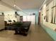 Community billiard room with pool table and wall mounted pool cues at 4001 58Th N St # 18, Kenneth City, FL 33709