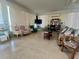 A sitting area is decorated with chairs, couches and tables at 4001 58Th N St # 18, Kenneth City, FL 33709