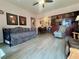 The living room opens to the dining area and offers wood flooring at 4001 58Th N St # 18, Kenneth City, FL 33709