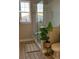 Bright bathroom featuring a glass-enclosed shower, tiled floors, and a large window at 4053 Rocky Shores Dr, Tampa, FL 33634