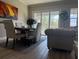 Dining area with natural light, table, chairs, and view through the patio door at 4053 Rocky Shores Dr, Tampa, FL 33634