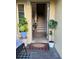 Inviting entryway with tiled floors, indoor plants, a welcome mat, and staircase at 4053 Rocky Shores Dr, Tampa, FL 33634