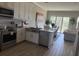 Modern kitchen with stainless steel appliances and a view of the dining area at 4053 Rocky Shores Dr, Tampa, FL 33634