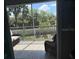 Inviting screened patio with comfortable seating and lush green views at 4053 Rocky Shores Dr, Tampa, FL 33634
