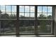 Bright window view overlooking a golf course and green space with scenic views of palm trees and blue skies at 4053 Rocky Shores Dr, Tampa, FL 33634