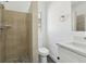 Bathroom with a shower that has neutral tile, dark floors, and a new sink at 419 40Th S Ave, St Petersburg, FL 33705