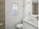 Bathroom with modern toilet, vanity with white countertop, mirror, and new fixtures at 419 40Th S Ave, St Petersburg, FL 33705