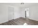 Bedroom featuring hard wood floors, white walls, and a closet at 419 40Th S Ave, St Petersburg, FL 33705