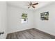 Minimalist bedroom design, accentuated by sleek laminate flooring, neutral walls, and natural light at 419 40Th S Ave, St Petersburg, FL 33705