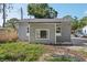 Side view of home with white windows and a gray exterior at 419 40Th S Ave, St Petersburg, FL 33705