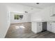 Spacious living room features modern laminate flooring and an open layout to the kitchen area at 419 40Th S Ave, St Petersburg, FL 33705