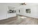 Bright and airy living room with sleek laminate flooring, complemented by an open kitchen area at 419 40Th S Ave, St Petersburg, FL 33705