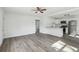 Modern living space features open layout to the kitchen, laminate flooring, and abundant natural light at 419 40Th S Ave, St Petersburg, FL 33705