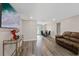 Open-concept living room flowing into the dining area, featuring sleek flooring and natural light at 4416 W Minnehaha St, Tampa, FL 33614