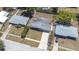 Aerial view showcases the property's layout, including the home, driveway, and fenced backyard at 4732 W Wyoming Ave, Tampa, FL 33616