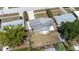 Aerial view of a single-Gathering home with a fenced backyard and mature trees at 4732 W Wyoming Ave, Tampa, FL 33616