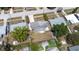 Aerial view of a single-Gathering home with a fenced backyard and mature trees, gray shingle roof at 4732 W Wyoming Ave, Tampa, FL 33616