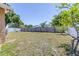 Spacious backyard with a wood fence, offering privacy and room for recreation at 4732 W Wyoming Ave, Tampa, FL 33616