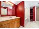 Bathroom features a vanity, sink, walk-in shower, and soaking tub at 4732 W Wyoming Ave, Tampa, FL 33616
