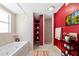 Modern bathroom featuring a soaking tub, walk-in shower, and contemporary fixtures at 4732 W Wyoming Ave, Tampa, FL 33616