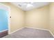 Bedroom with neutral paint, carpet, and ceiling fan for comfort at 4732 W Wyoming Ave, Tampa, FL 33616