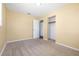 Bedroom with tan walls and carpet flooring, walk-in closet and natural light at 4732 W Wyoming Ave, Tampa, FL 33616