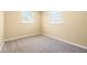 Neutral bedroom with large window and beige carpet at 4732 W Wyoming Ave, Tampa, FL 33616