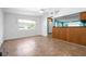 Large bonus room with access to kitchen and views to backyard at 4732 W Wyoming Ave, Tampa, FL 33616