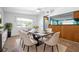 Bright dining room with table and chairs, adjacent to the kitchen at 4732 W Wyoming Ave, Tampa, FL 33616