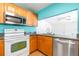 Updated kitchen with stainless steel appliances, granite counters, and wood cabinetry at 4732 W Wyoming Ave, Tampa, FL 33616