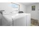 Laundry room with white washer and dryer at 4732 W Wyoming Ave, Tampa, FL 33616